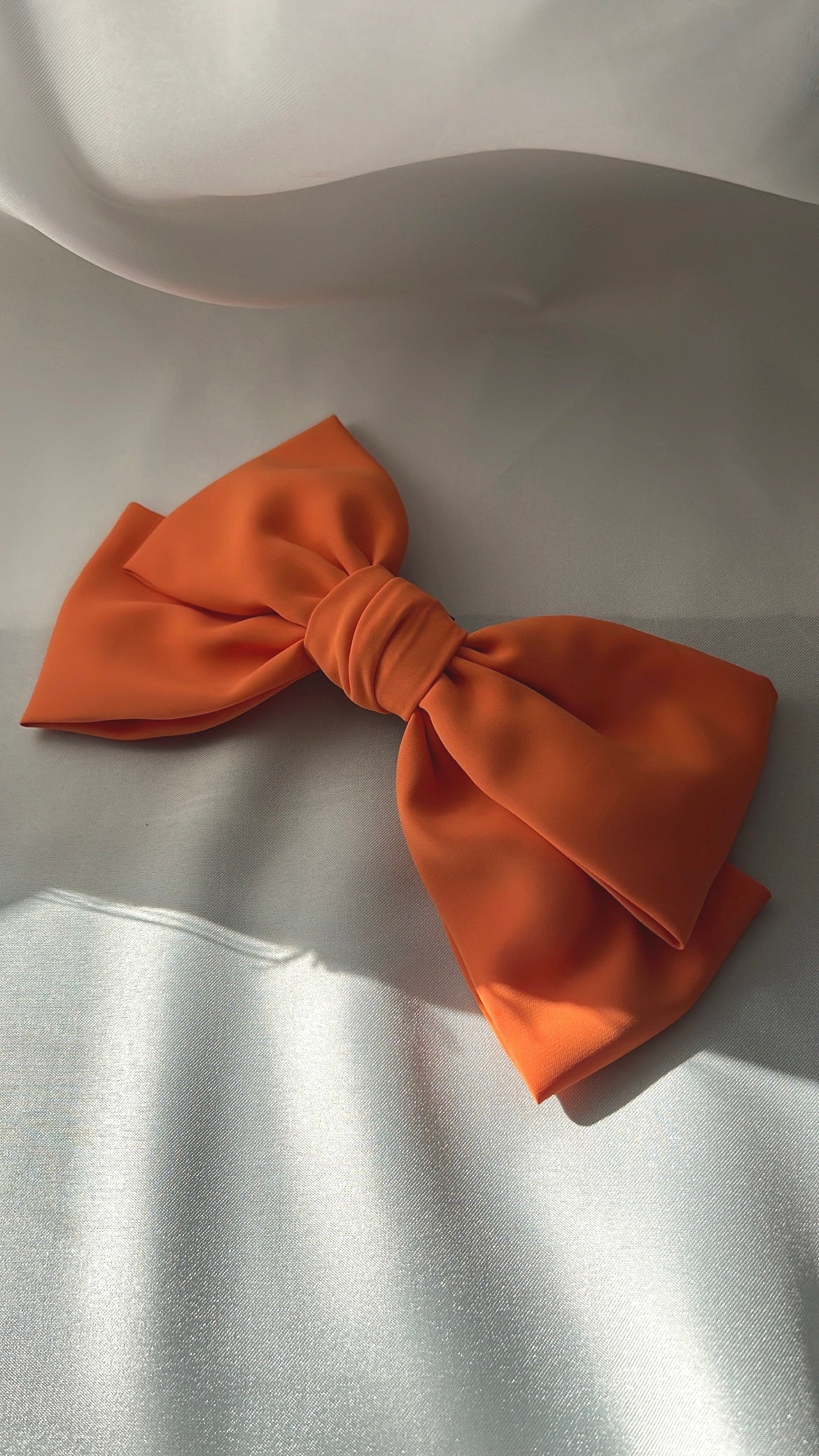 Sara coral orange bow 