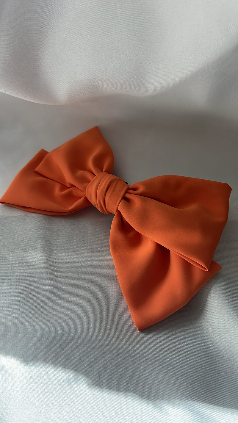 Sara coral orange bow 